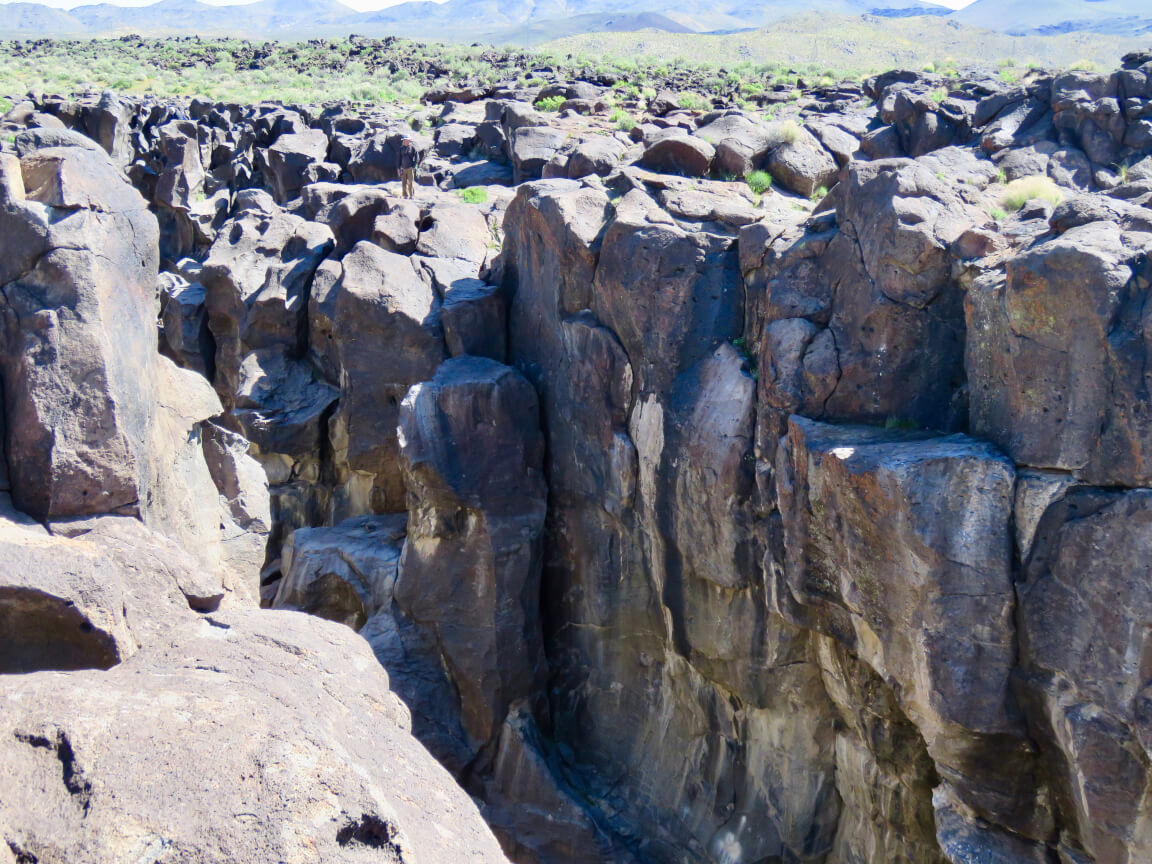 The crevasse at Fossil Falls, a canyon of black basaltic rock sculpted by eons of water.