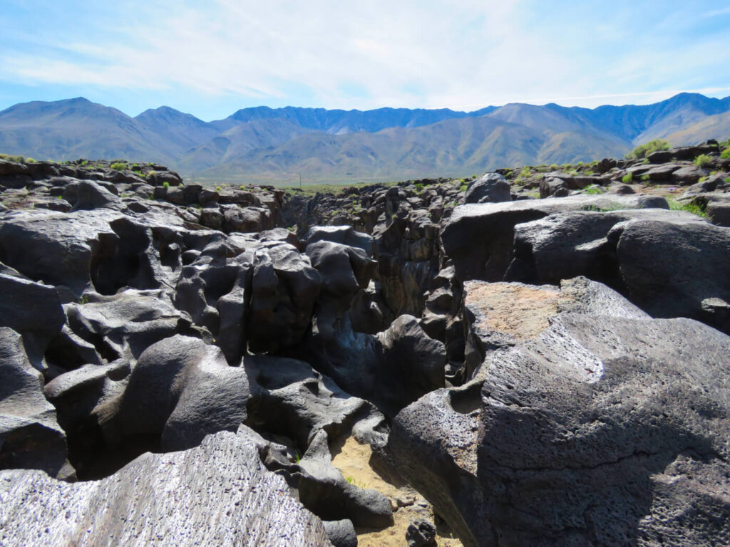 A surreal canyon of basaltic black lava rock beautifully sculpted by eons of rushing water from a prehistoric age